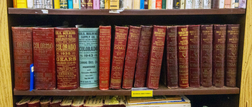 One shelf at the “Secret Bookshop” has business directories, some from almost a century ago. (The Gazette, Jerilee Bennett)