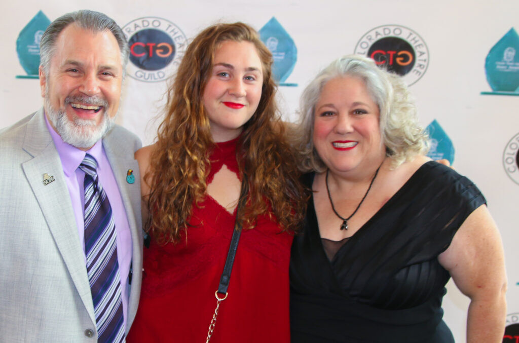 Olivia Wilson, center, is the daughter of CenterStage Theatre Company Executive Artistic Director Steve Wilson, left, and Leslie O'Carroll, who played Mrs. Fezziwig in the Dever Center Theatre Company's seasonal 'A Christmas Carol' for many years. JOHN MOORE/DENVER GAZETTE