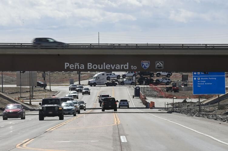 A busy road under a bridge