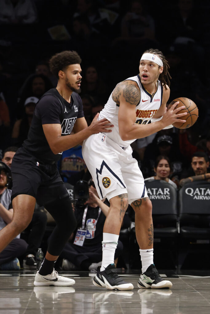 Denver Nuggets forwards Cam Johnson and Aaron Gordon