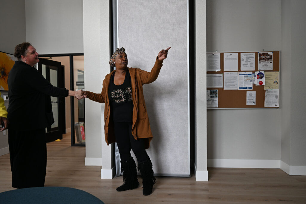 a woman standing inside a modern apartment building