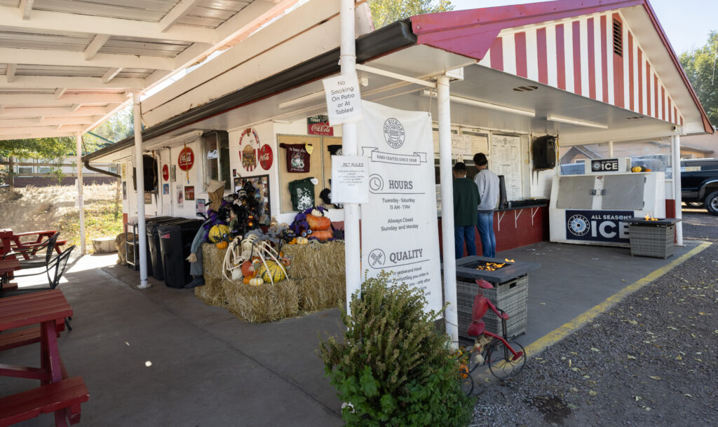 Customers place an order at the window of the Big Burger World restaurant in Canon City on Wedneday, Oct. 29, 2025. The restaurant opened in 1968. (The Gazette, Christian Murdock)