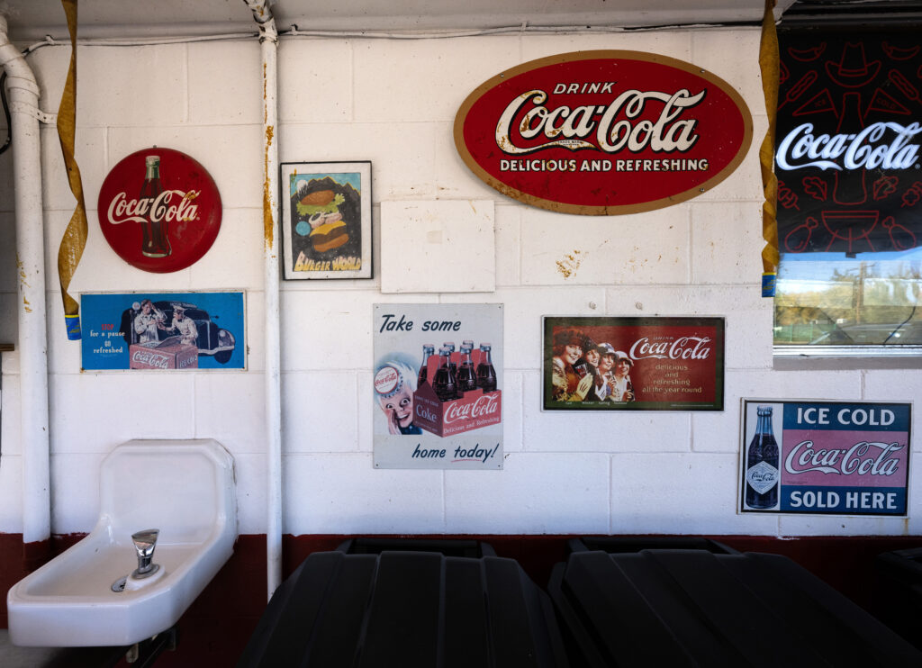 Old CocaCola signs decorate the cinder block walls of the Big Burger World restaurant in Canon City Wednesday, Oct. 29, 2025. The restaurant opened in 1968. (The Gazette, Christian Murdock)