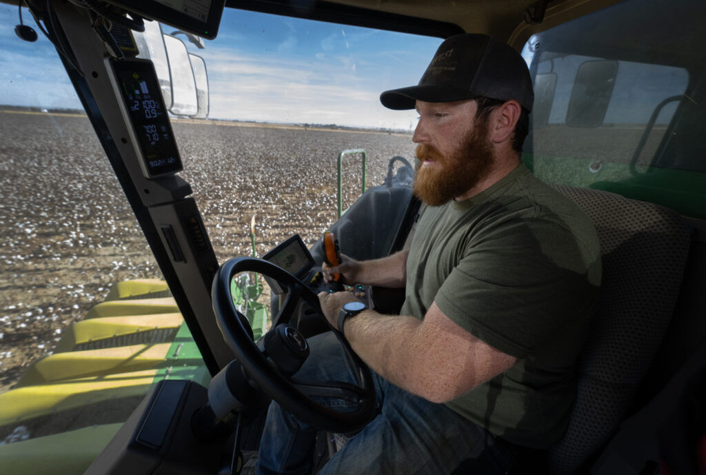 Farmer Caleb Wertz driving a harvester