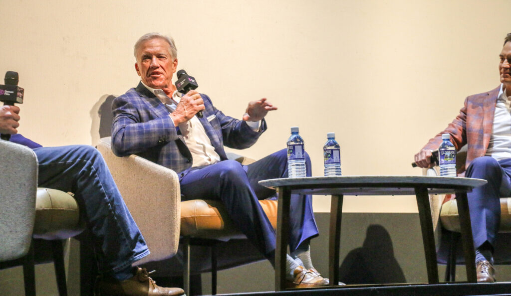 John Elway is interviewed by CBS4's Michael Spencer from the stage of the Ellie Caulkins Opera House on Nov. 8, 2025, after the Denver Film Festival's world-premiere screening of the new Netflix documentary 'Elway.' (John Moore, The Denver Gazette)