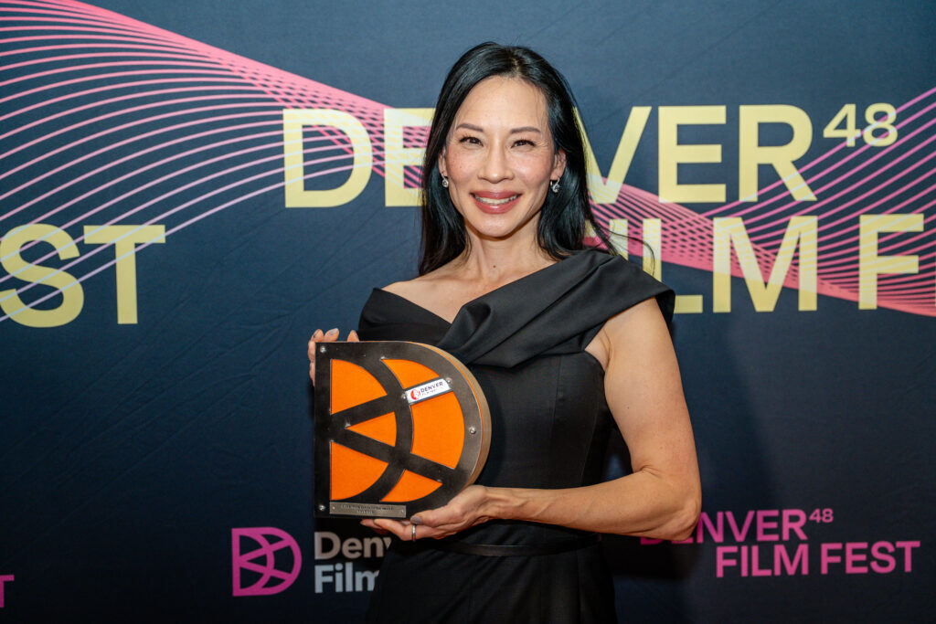 Actor and producer Lucy Liu she receives the 2025 John Cassavetes Award, Nov. 8, 2025, at the MCA Denver Holiday Theater. (Beau Ngu for Denver Film)