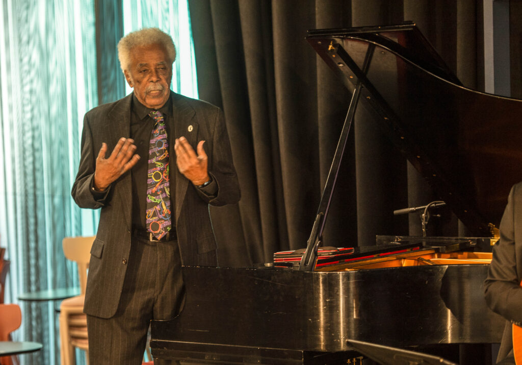 Pianist Purnell Steen addresses the crowd at Dazzle Denver at the  promotional launch of Denver Arts Week on Nov. 1, 2024, at Dazzle Denver. (John Moore, Denver Gazette)