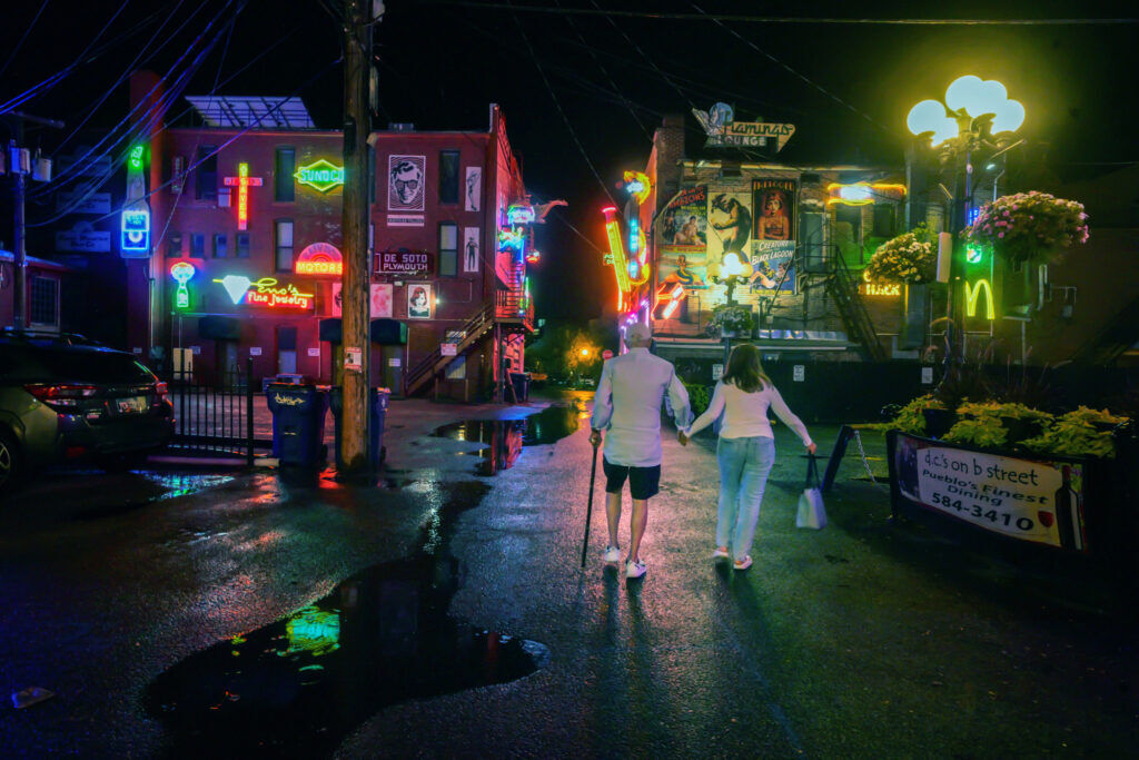 Joe and Mary Koncilja walk through “Neon Alley” in Pueblo. Joe is an attorney in Pueblo and the owner of “Neon Alley”. (The Gazette, Jerilee Bennett)