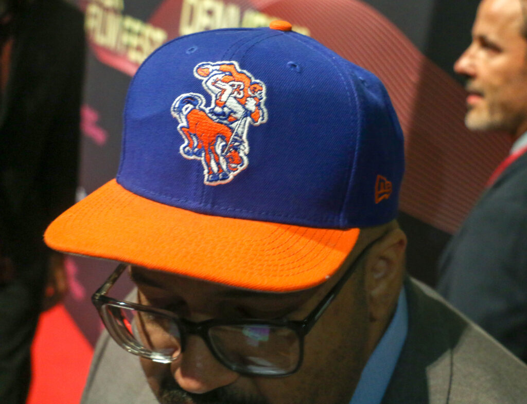 Denver filmmaker (and huge Broncos fan) Matt Sandoval walks the red carpet with his vintage hat before the Denver Film Festival's world-premiere screening of the new Netflix documentary 'Elway' at the Ellie Caulkins Opera House in Denver, Colo. Nov. 8, 2025. (John Moore, The Denver Gazette)