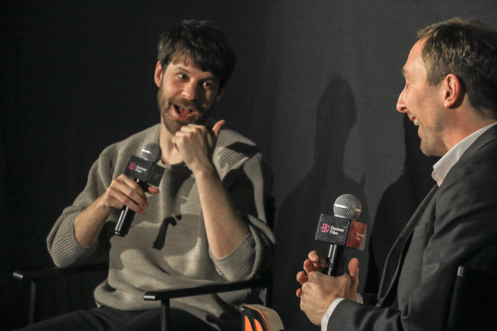 Charlie Polinger, left, director of 'The Plague,' speaks with Denver Film Artistic Director Matt Campbell after receiving the festival's Breakthrough Director Award on Nov. 2, 2025, at the Sie Film Center. (John Moore, Denver Gazette)