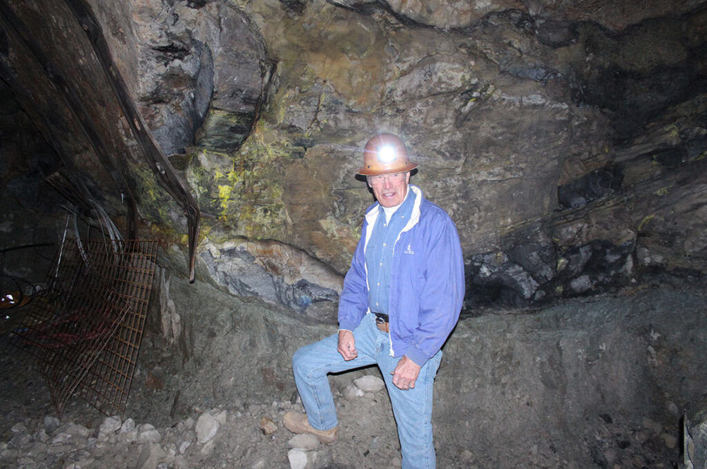 George Glasier, president and CEO of Western Uranium & Vanadium, stands in front of a high-grade uranium ore deposit three miles underground in the Sunday complex uranium mine near Nucla, Colo..