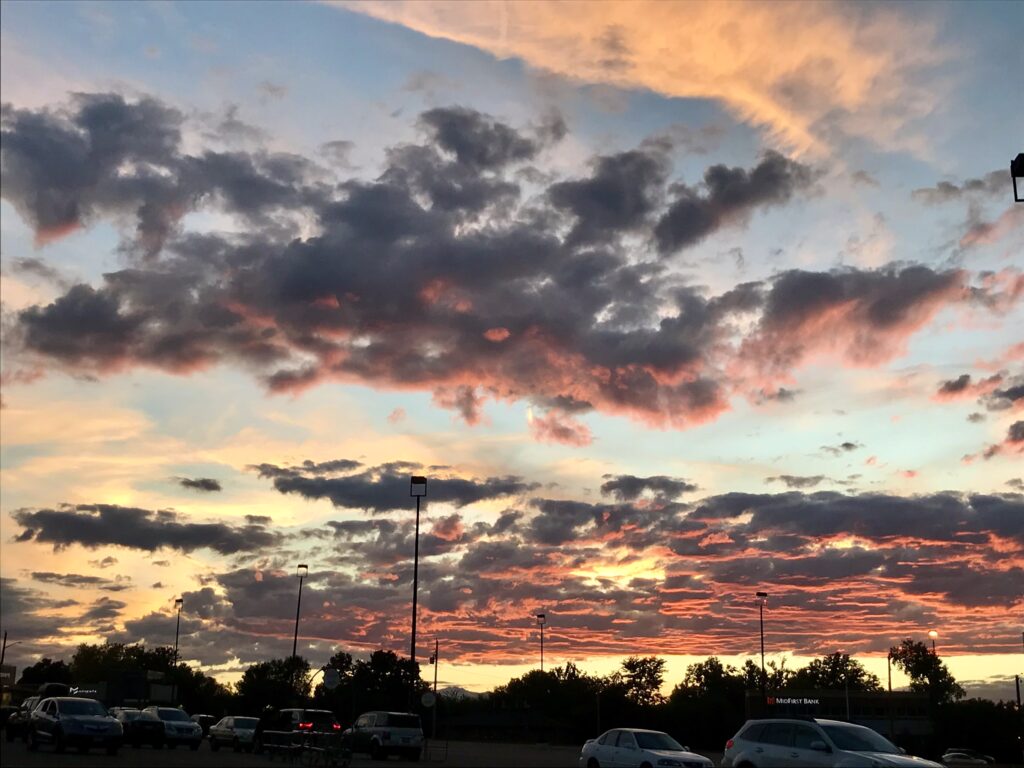 Sunset view from the late Chez Artiste parking lot across the University Hills parking lot looking west at the Colorado mountains. (Courtesy Robin Hyden)