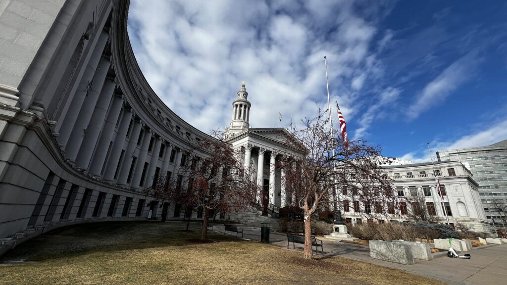 a city government building with prominent Roman columns