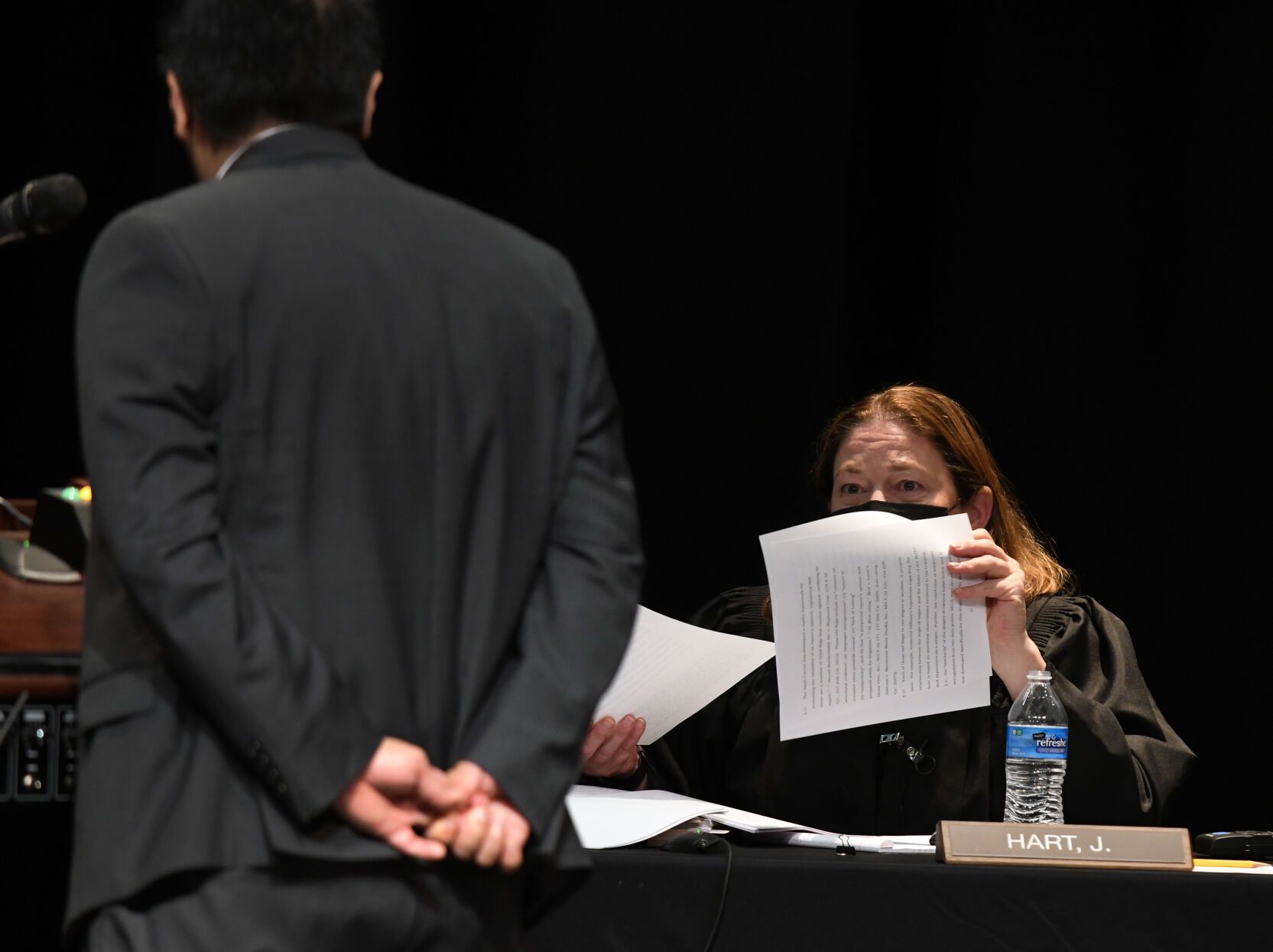 Attorney John T. Lee presents his arguments in The People of the State of Colorado v. Jose Ornelas-Licano case before the seven members of the Colorado Supreme Court, including Justice Melissa Hart, right, at Pomona High School before an audience of students Oct. 26, 2021 in Arvada. Photo by Kathryn Scott)