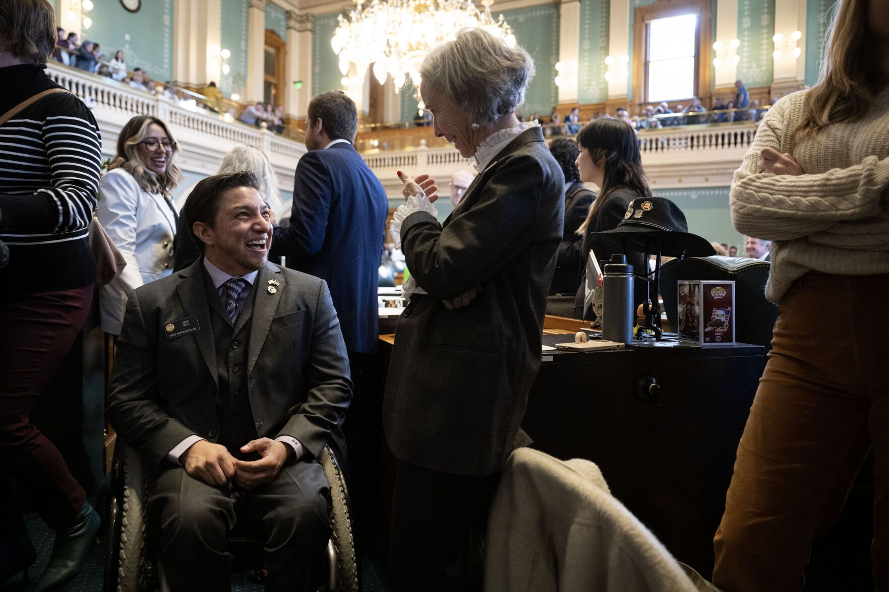 Rep. Judy Amabile and Rep. David Ortiz share a laugh during the first day of Colorado's 2023 session at the Colorado State Capitol building on Monday, Jan. 9, 2023, in Denver, Colo. (Timothy Hurst/The Denver Gazette)