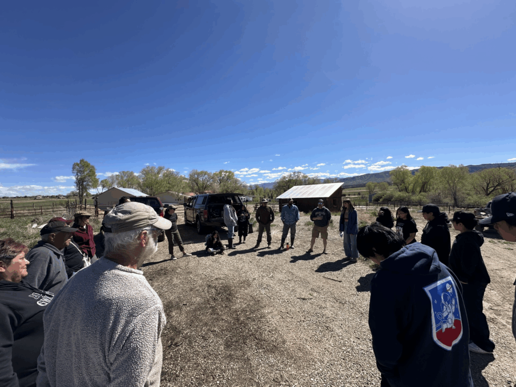 Regina Lopez-Whiteskunk, lower left corner in black hoodie, speaks to members of the Ancestral Lands Conservation Corp near the Mancos River. Photo courtesy Regina Lopez-Whiteskunk
