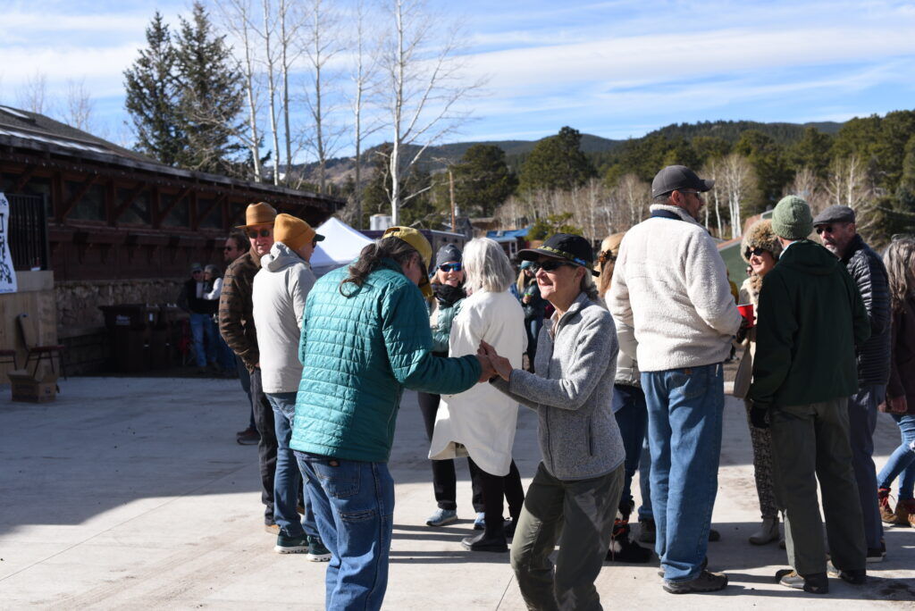 People dance in the sun