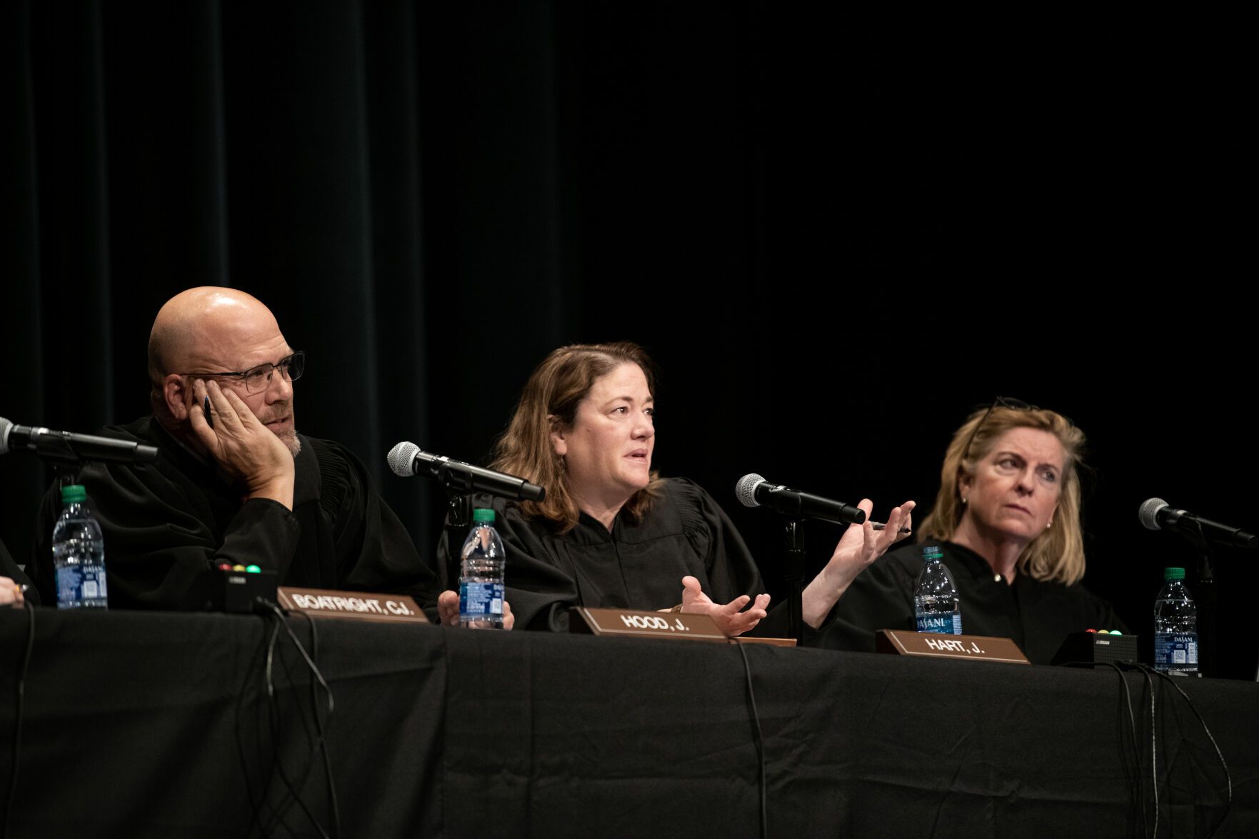 From left, Colorado Supreme Court Justices William Hood III, Melissa Hart and Maria Berkenkotter listen to an argument during a Courts in the Community session held at Pine Creek High School in Colorado Springs on Thursday, Nov. 17, 2022. (The Gazette, Parker Seibold).