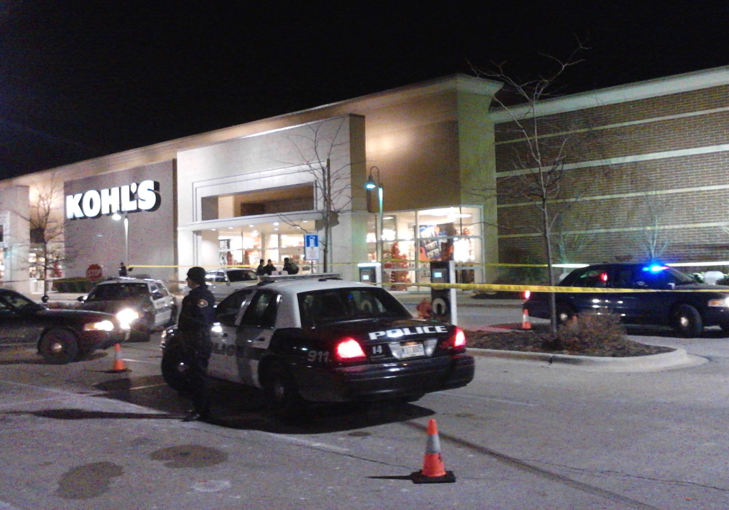 In this Nov. 28, 2013 photo police respond to a call at department store open on Thanksgiving in Romeoville, Ill., after an alleged shoplifting incident. (AP Photo/Chicago Sun-Times, Frank Vaisvilas)