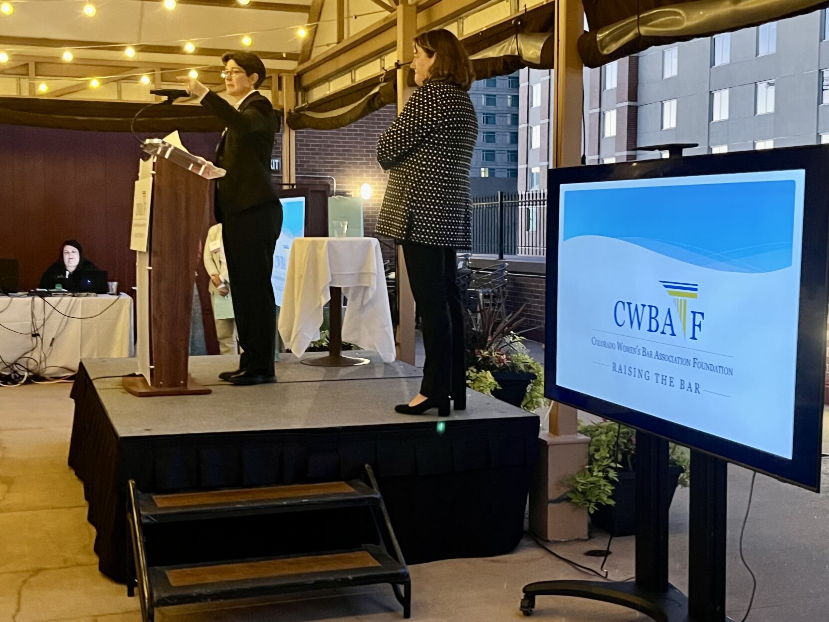 Justice Monica M. Márquez accepts the “Raising the Bar” award from the Colorado Women’s Bar Association Foundation Sept. 7, 2023 during a ceremony at the Denver Athletic Club. Justice Melissa Hart is at right. (Michael Karlik/Colorado Politics)