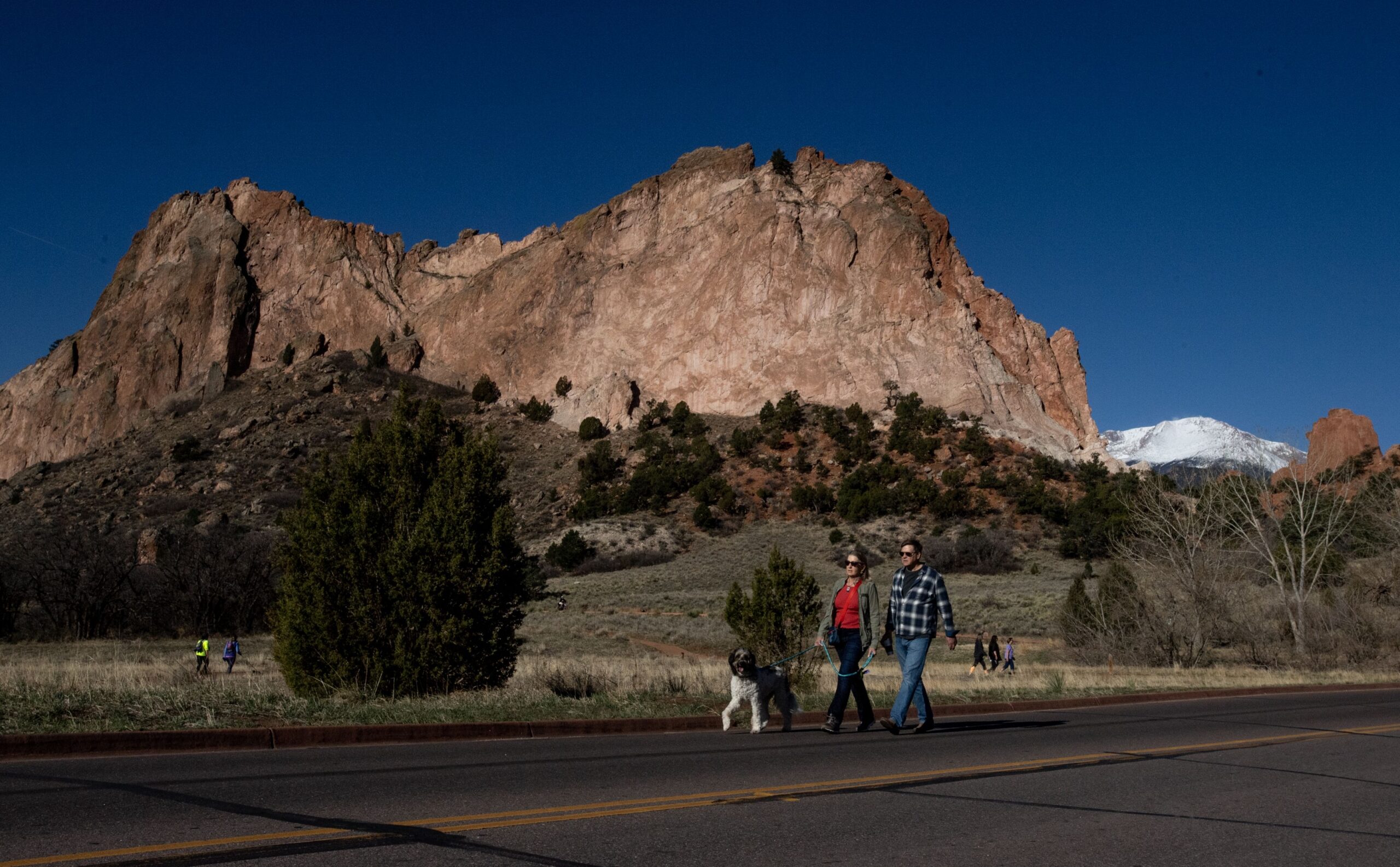 People walk the open road during the first Motorless Morning of the year at Garden of the Gods Park in Colorado Springs on April 29, 2023. The special event shuts down the road to motor vehicle access within the park from 5 a.m.-noon, allowing people the opportunity to bike, walk, run, roller blade, skateboard without vehicles driving on the popular road. Gazette photo