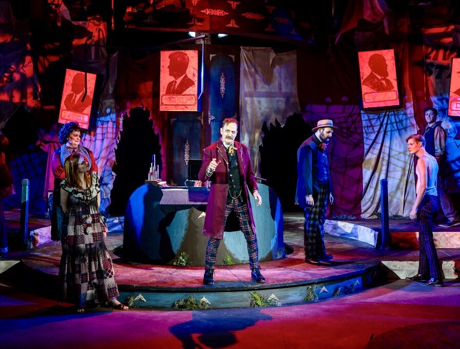 Drew Horwitz leads the cast of Miners Alley Performing Arts Center's 2025 staging of 'Assassins,' directed by Warren Sherrill in Golden (Soular Radiant Photography)