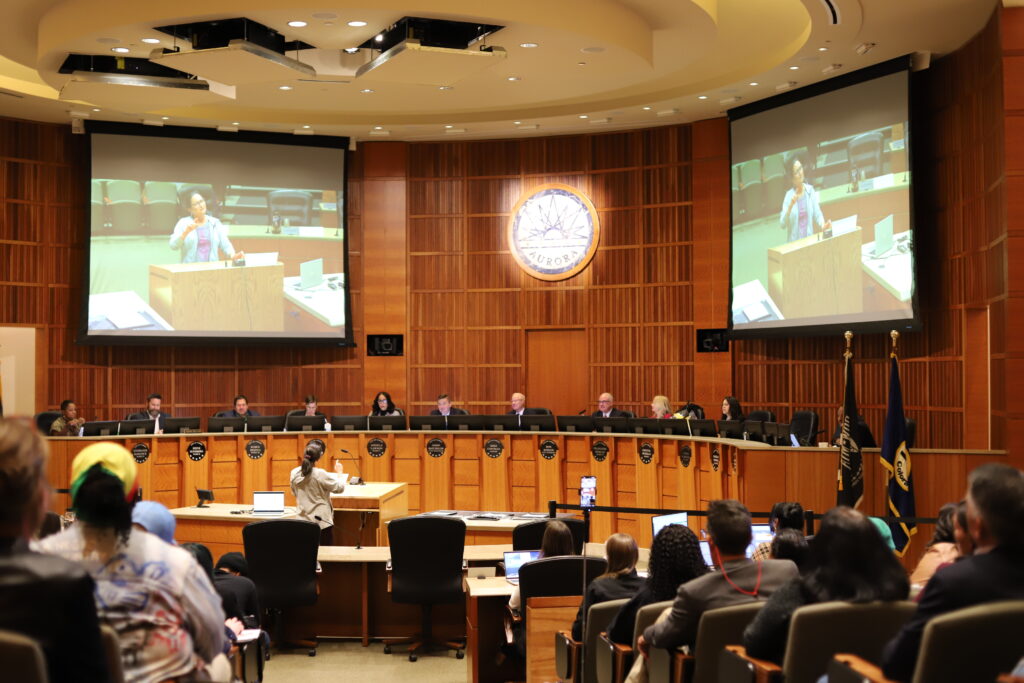 Aurora City Council hears from a public speaker in an in-person meeting on Nov. 17, 2025.