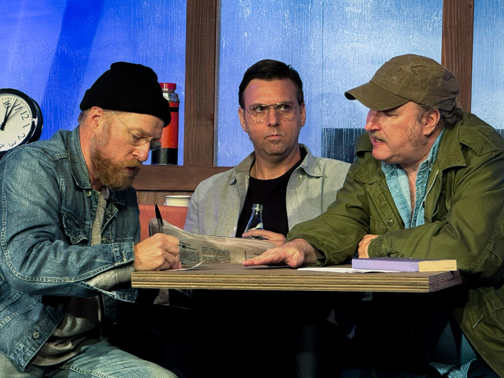 From left: Colin Gregory (as Richard Dreyfuss), Matt Radcliffe (as Roy Scheider) and Steve Emily (as Robert Shaw) in Spring Ensemble Theatre's 2025 staging of 'The Shark is Broken. (Emory John Collinson)