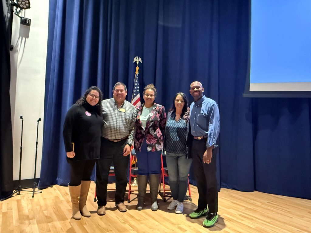 Gianina Horton, Ruben Medina, Alli Jackson, Amy Wiles and Rob Andrews stand together for a photo. They are Aurora's new councilmembers-elect in November 2025.