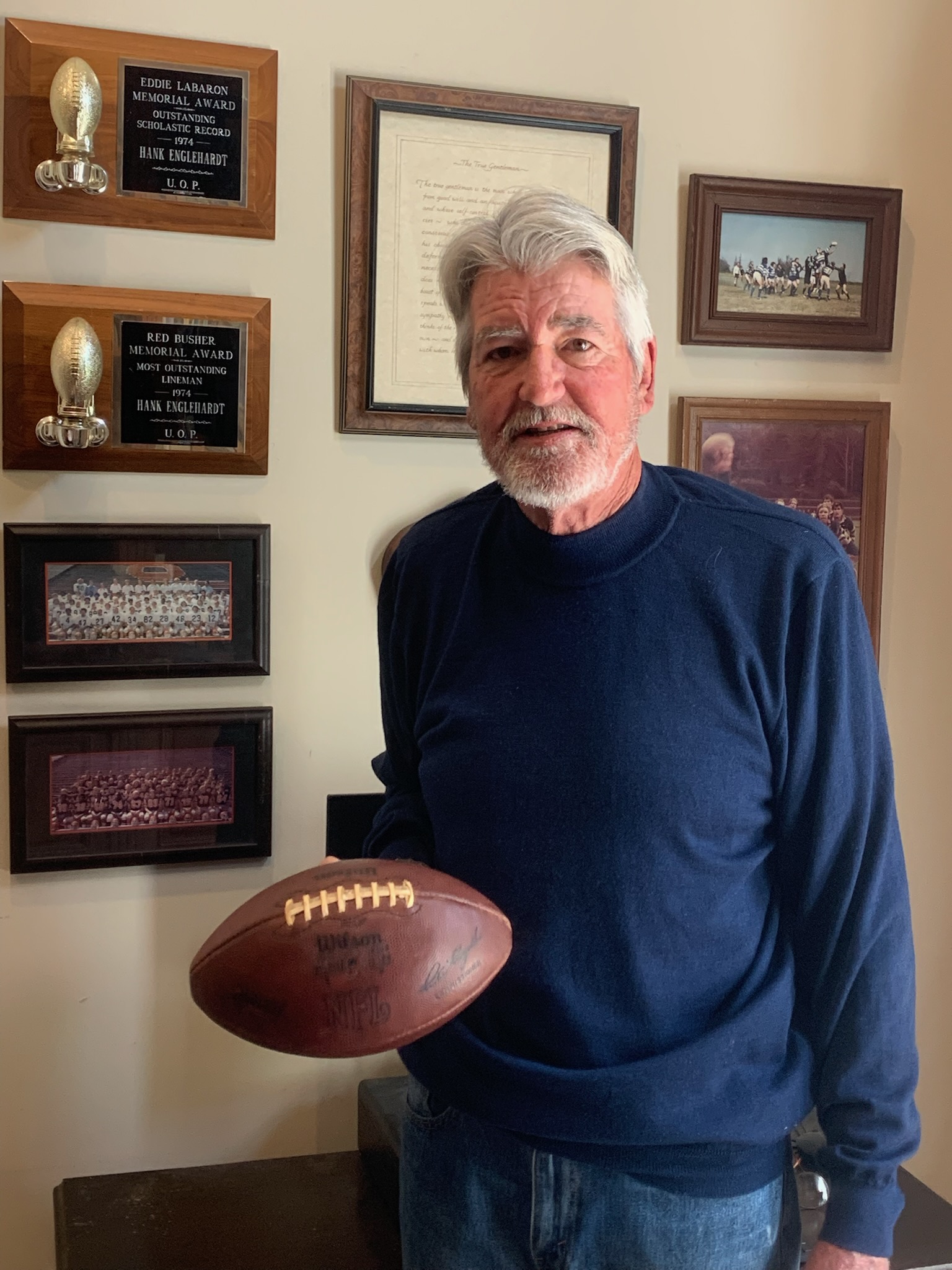 Hank Englehardt at his home in Livermore, Calif., in March 2025 with a football he used to practice snapping after being selected by the Denver Broncos in the 10th round of the 1975 NFL draft. Englehardt never played in a regular-season NFL game but went on to become successful in real estate in the San Francisco Bay Area. (Photo courtesy of Hank Englehardt) (Courtesy of Hank Englehardt)