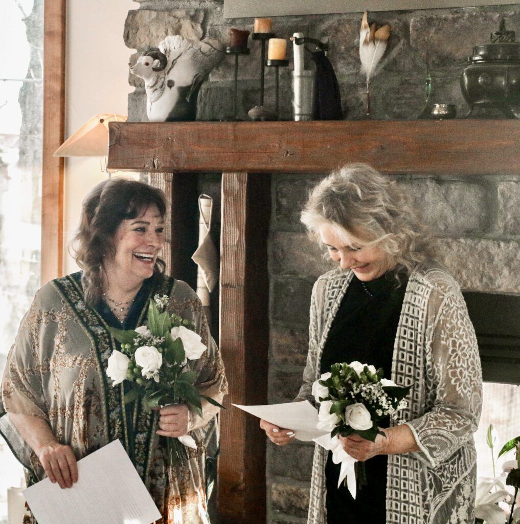 Wendy Ishii, left, and Deb 'Bo' Dimon were both married at different times to the late Douglas Ishii. They decided to legally wed each other in part to simplify the settlement of his estate. The ceremony took place on Jan. 4 in Ishii's Fort Collins home; it was made legal at the Larimer County Courthouse the next day. (John Moore, Denver Gazette)