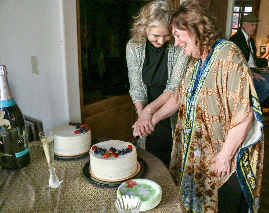 Cake and champagne at the wedding of Deb 'Bo' Dimon, left, and Wendy Ishii on Jan. 4 in Fort Collins. (John Moore, Denver Gazette)