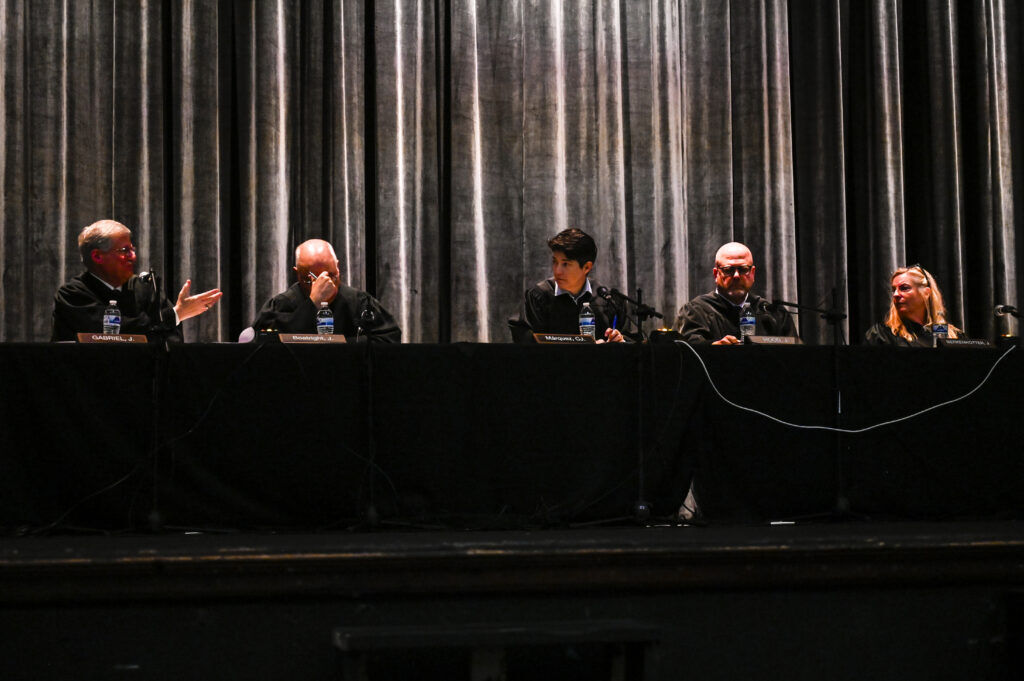 Colorado Supreme Court Justices ask questions at oral arguments in the auditorium at East High School during Courts in the Community on Thursday, Oct. 23, 2025. (Stephen Swofford, The Denver Gazette)