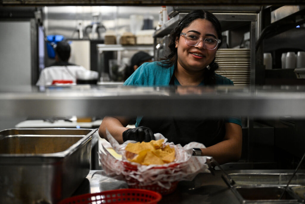 Employees make baskets of potato chips in the kitchen of the Cherry Cricket in Cherry Creek on Friday, Dec. 12, 2025. (Stephen Swofford, Denver Gazette)