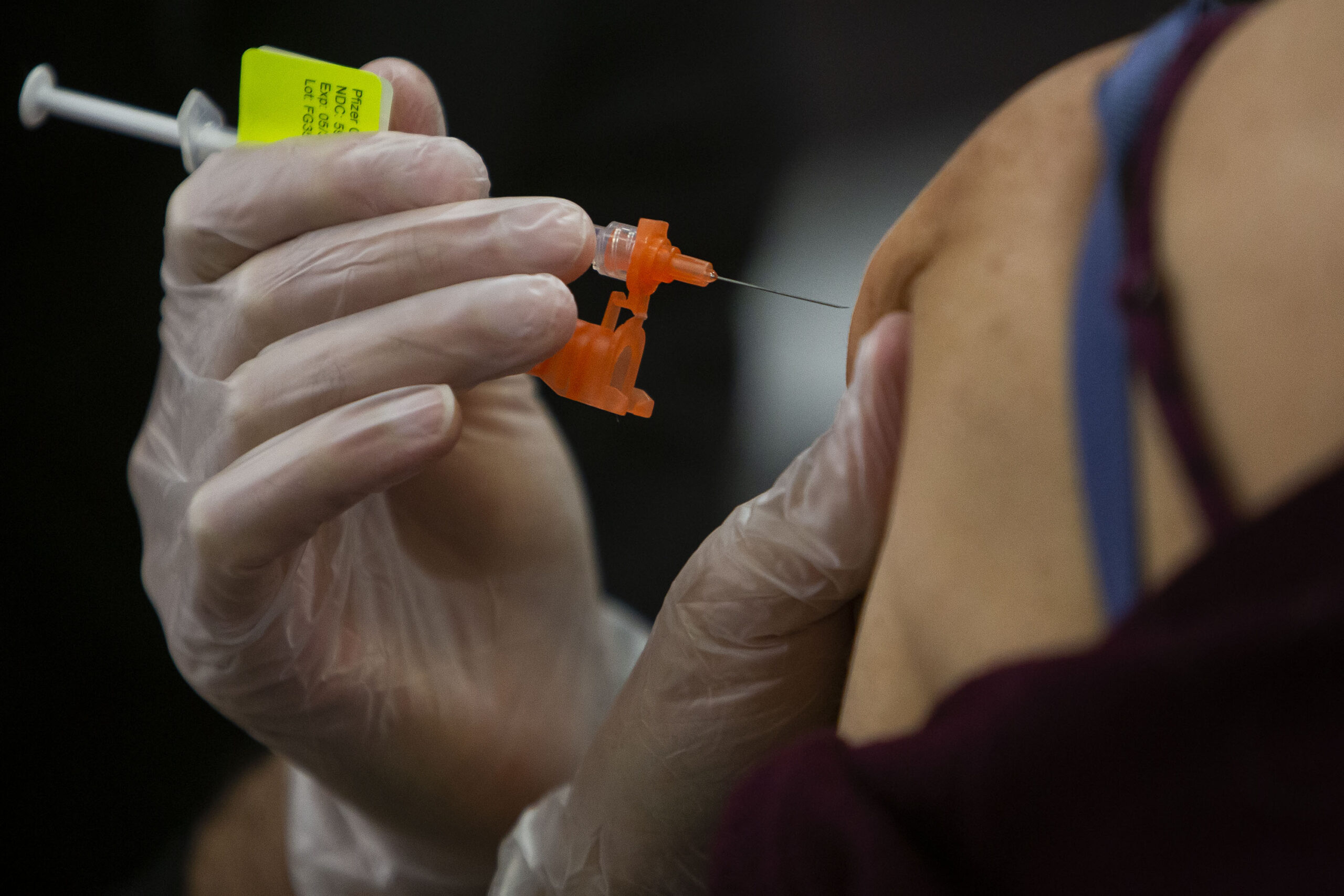 FILE PHOTO: A UCHealth patient gets a COVID-19 booster shot. (Timothy Hurst/Denver Gazette)