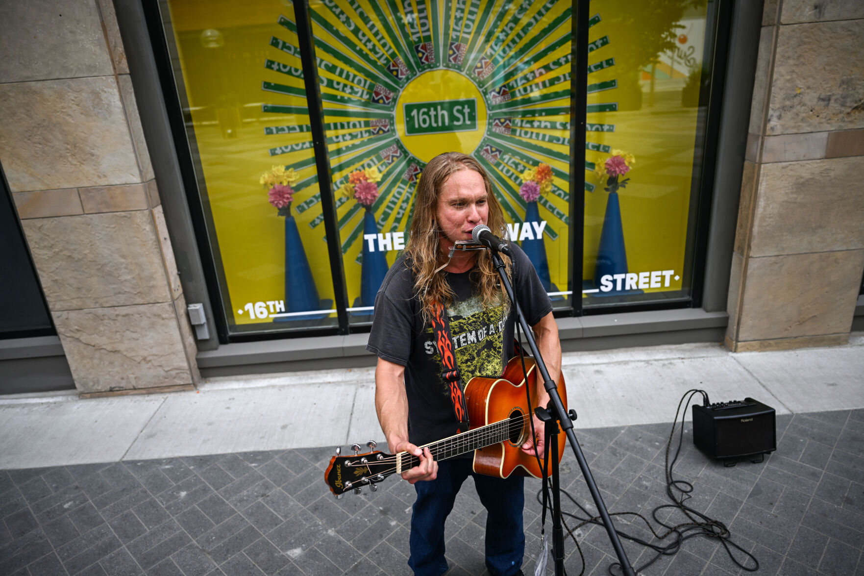 Greg Porch busks on 16th street on Tuesday, July 29, 2025. (Stephen Swofford, Denver Gazette) (Stephen Swofford)