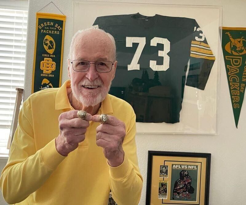 Jim Weatherwax, at his home in Loveland, Colo., in February 2023, shows off at rings he won for Super Bowl I in 1967 and Super Bowl II in 1968 while playing for the Green Bay Packers. Weatherwax, a defensive tackle for the Packers from 1966-69, has lived in Colorado since 1999. Photo courtesy of Weatherwax family.