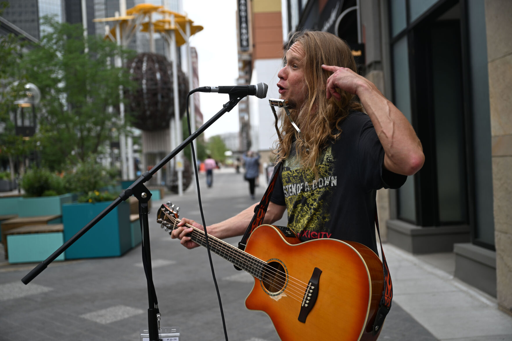 Greg Porch busks on 16th street on Tuesday, July 29, 2025. (Stephen Swofford, Denver Gazette) (Stephen Swofford)