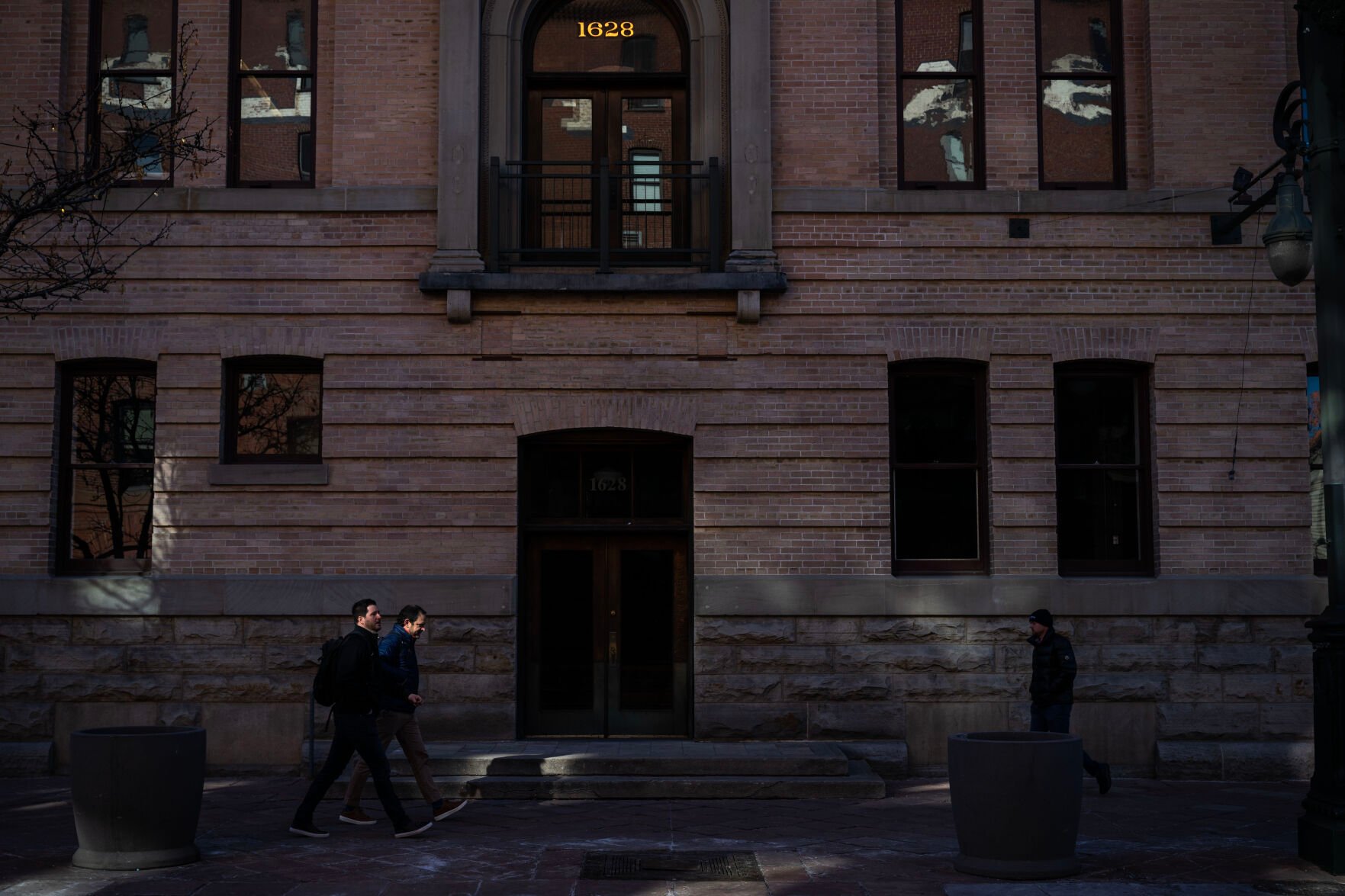 People walk along 16th Street Mall near Wynkoop Street on Monday near the site of one of four stabbings that occurred last weekend. (Stephen Swofford, the Denver Gazette)