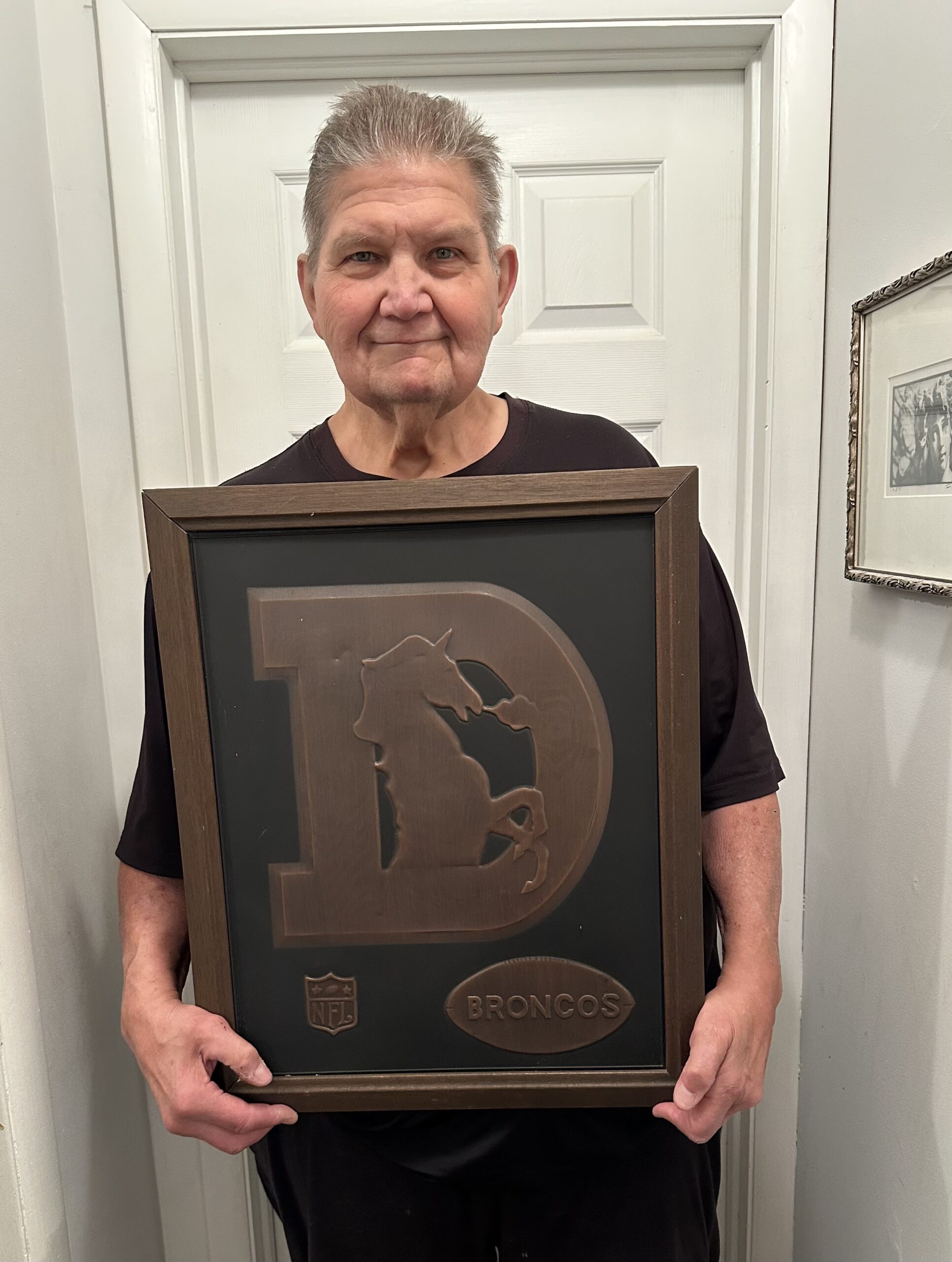 Stan Rogers, a tackle from Maryland taken by the Denver Broncos in the fifth round of the 1975 NFL draft, at his home in Gilbertsville, Pa., in March 2025 with a Broncos souvenir from the one season he spent with the team as a rookie. He went on to be a correction officer and counselor at Graterford (Pa.) Prison for 25 years, including spending 10 years on Death Row. (Photo courtesy of Stan Rogers.) (Courtesy of Stan Rogers)