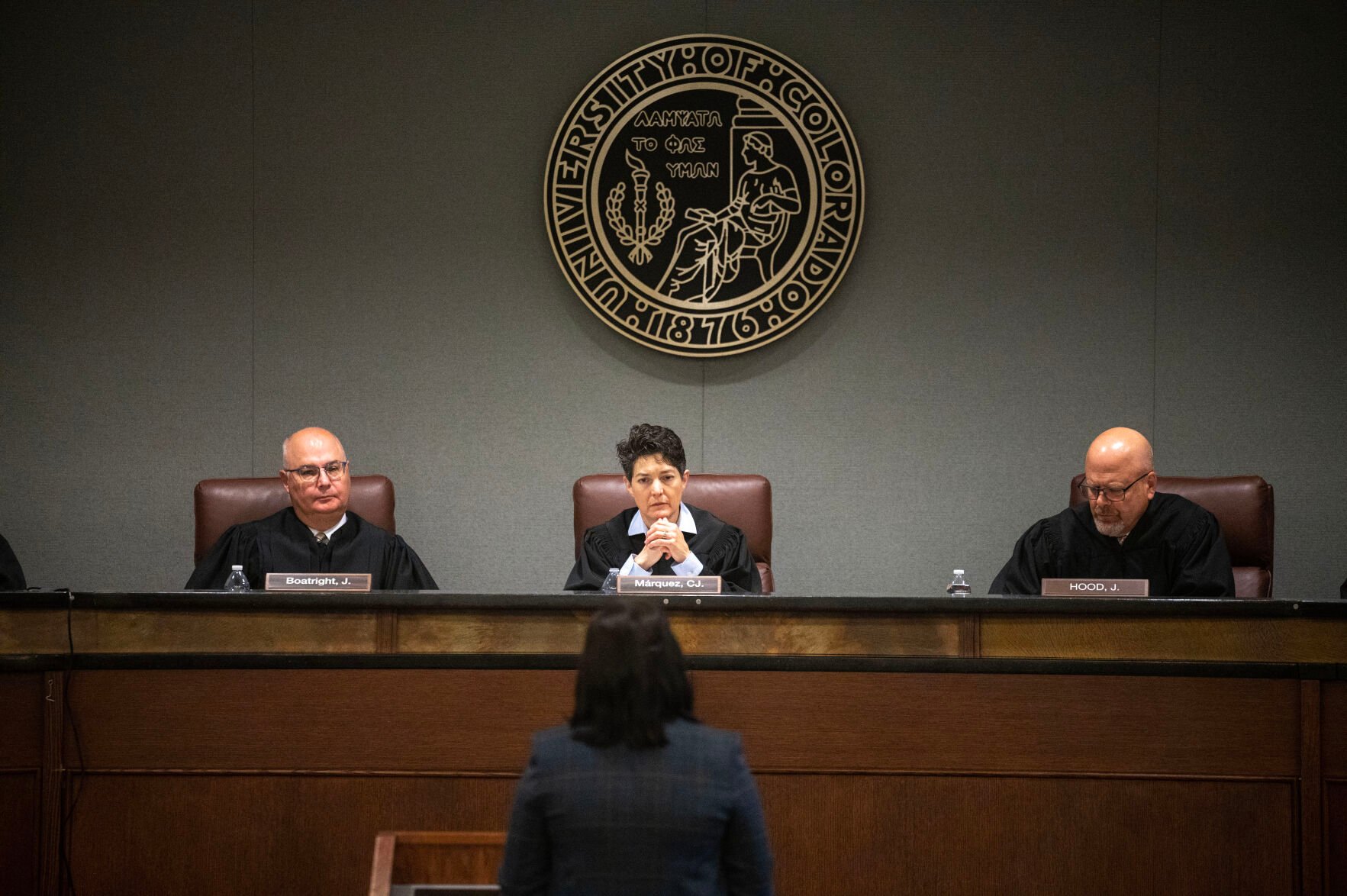 (From left) Colorado Supreme Court Justice Brian D. Boatright, Chief Justice Monica M. Márquez and Justice William W. Hood III listen to arguments from Assistant Attorney General Caitlin E. Grant during the People v. Rodriguez-Morelos case as part of Courts in the Community at the Wolf Law building at University of Colorado Boulder on Thursday, Oct. 24, 2024. In the six years of data reviewed by The Denver Gazette, a chief justice has not denied any of the 177 requests to appoint a private judge. (Stephen Swofford, Denver Gazette) (Stephen Swofford Denver Gazette)