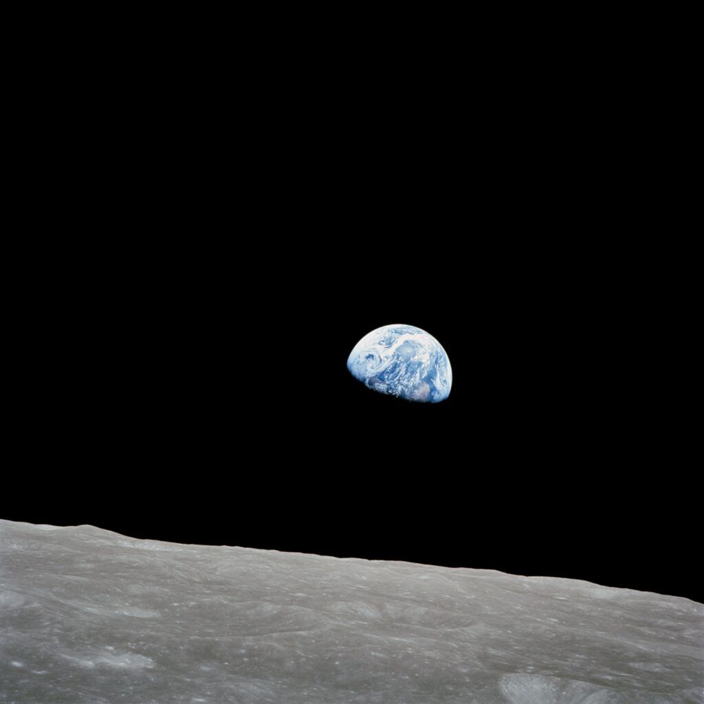 The earth rises over the lunar horizon in a picture taken by Apollo 8 in 1968. 