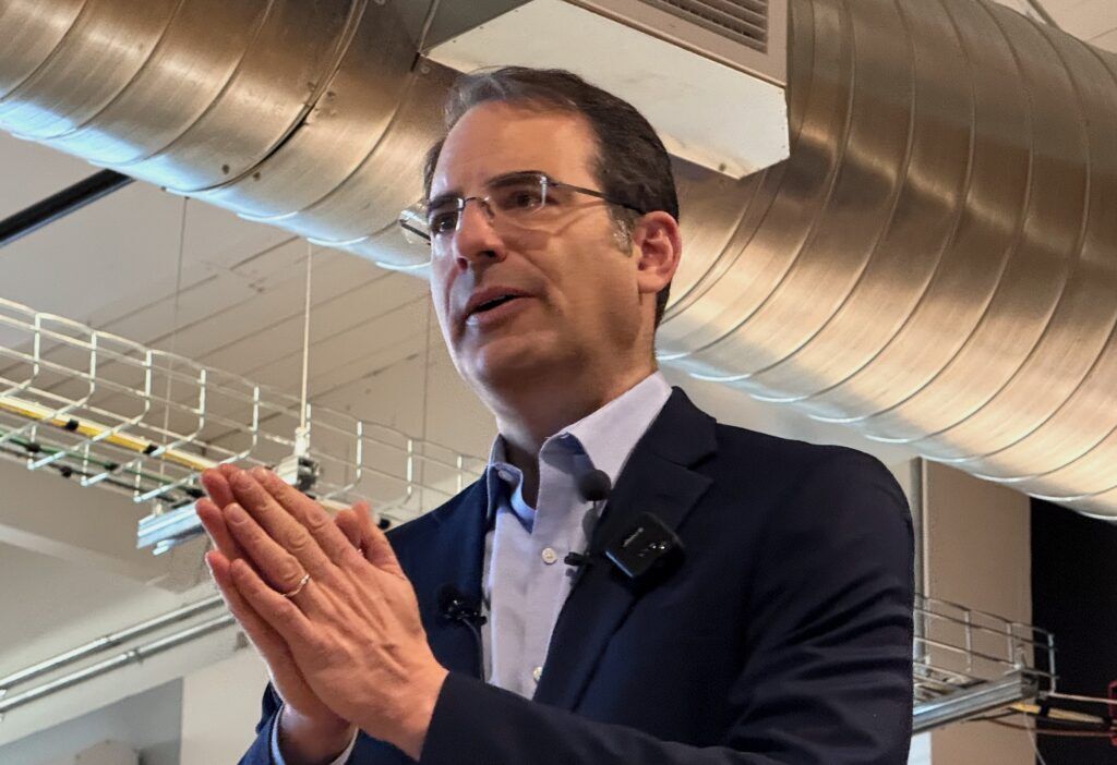 Democratic gubernatorial candidate Attorney General Phil Weiser speaks during a joint appearance with primary rival U.S. Sen. Michael Bennet at a forum sponsored by the Colorado Young Democrats on Saturday, Jan. 10, 2026, at the International Brotherhood of Electrical Workers Local 68 hall in Denver. (Ernest Luning/Colorado Politics)