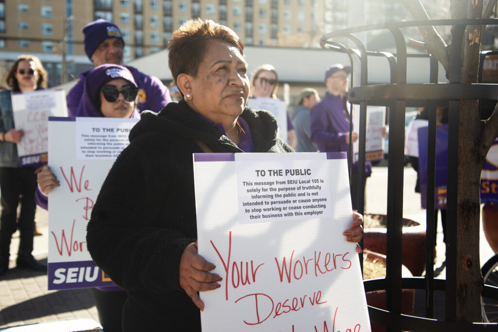 woman holding a picket sign