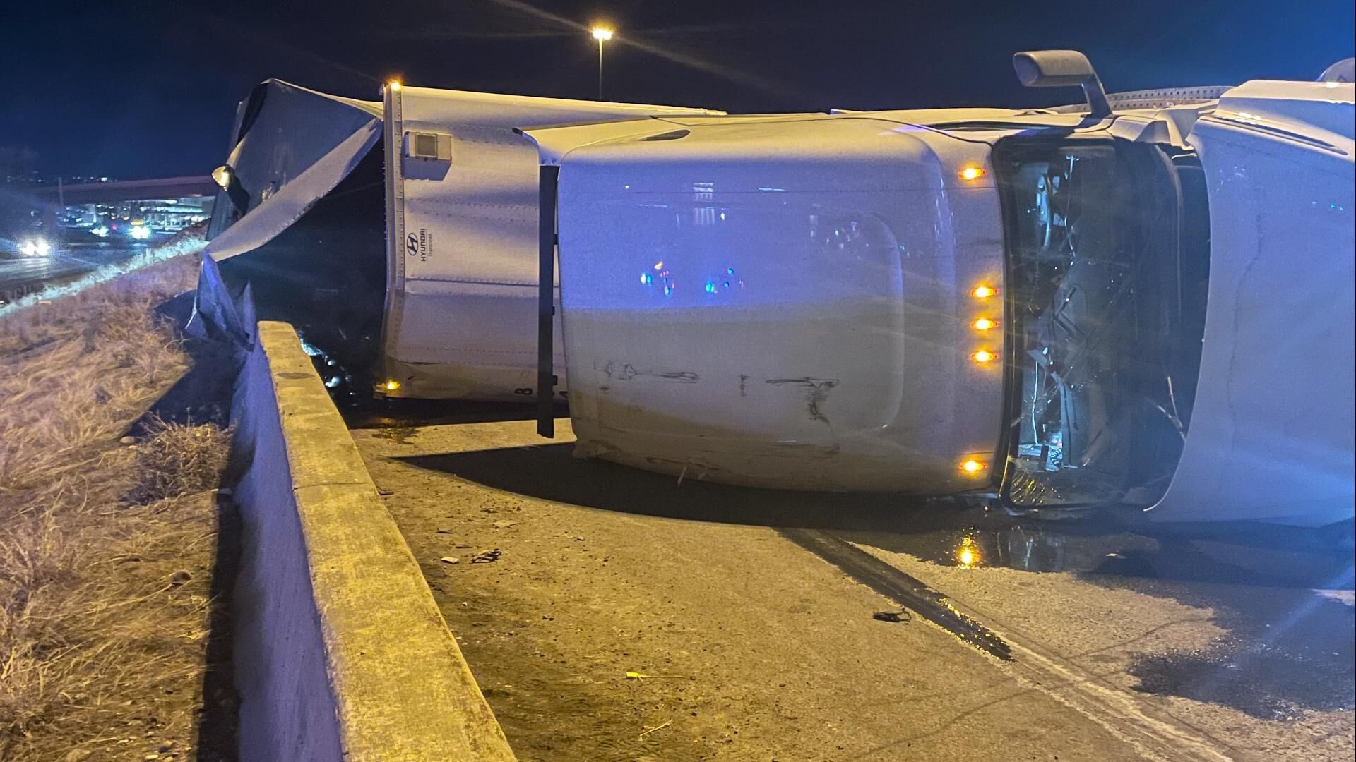Semi truck rollover spills Coors Banquet beer on I-70