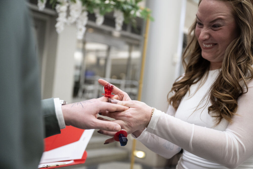 a couple exchanging wedding rings