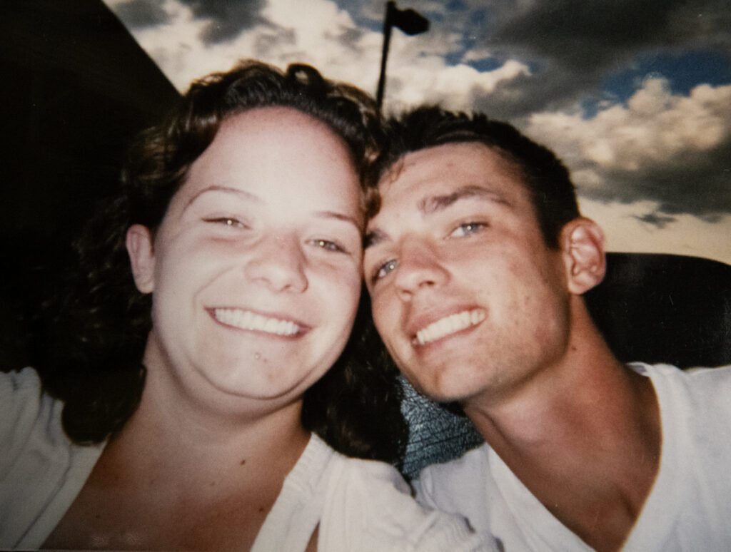 A couple smiles on a roller coaster. 