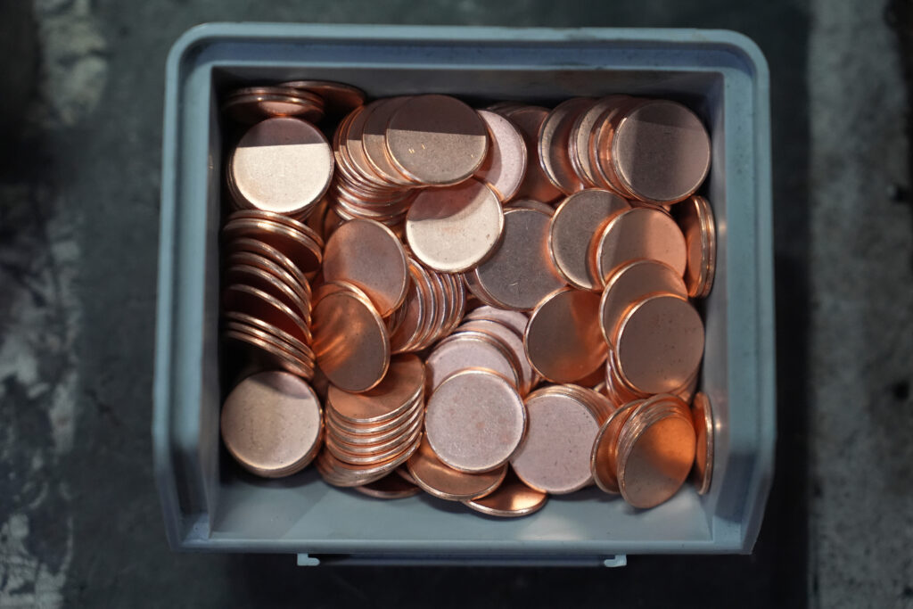The Associated Press Blank coins wait to be the last pennies pressed at the U.S. Mint in Philadelphia, Wednesday, Nov. 12, 2025.