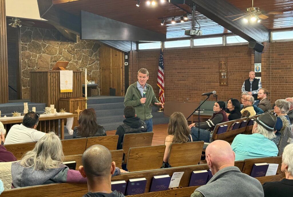 U.S. Sen. Michael Bennet, a Democratic gubernatorial candidate in Colorado, addresses a town hall on Feb. 7, 2026, at Good Shepherd Presbyterian Church in Northglenn. (Ernest Luning/Colorado Politics)