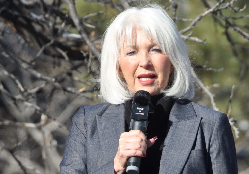 In this file photo, Mesa County Clerk Tina Peters addresses supporters on Dec. 1, 2022, outside Colorado Republican Party headquarters in Greenwood Village. (Ernest Luning, Colorado Politics, File)